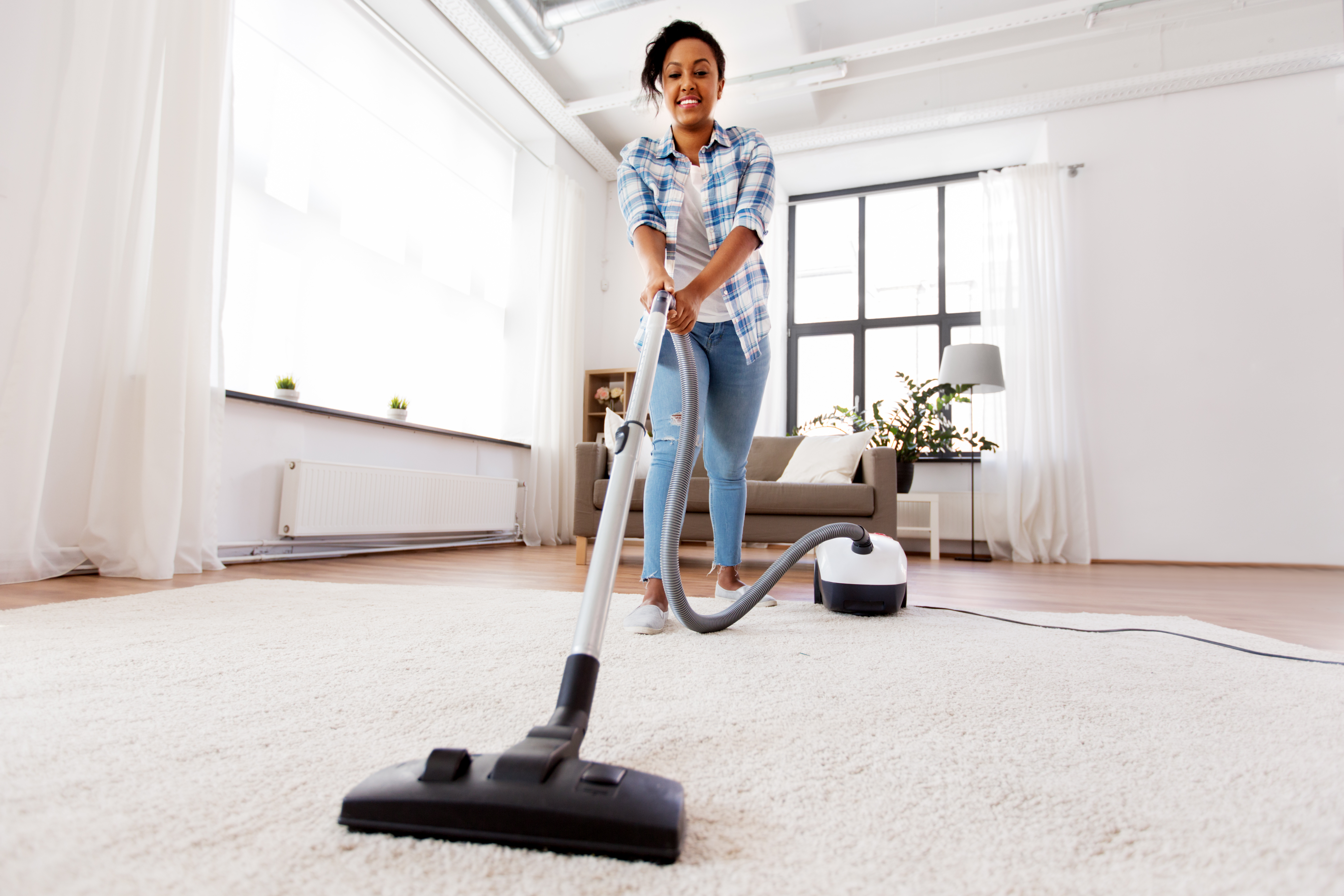 Lady Vacuuming the carpet